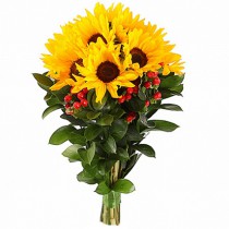 A bright bouquet of sunflowers and berries